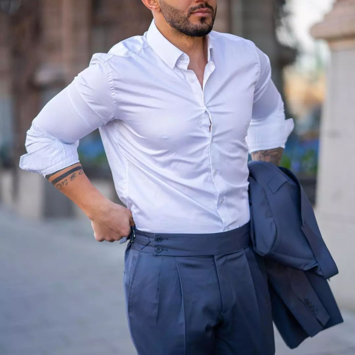 Men wearing White dress shirt and blue pants